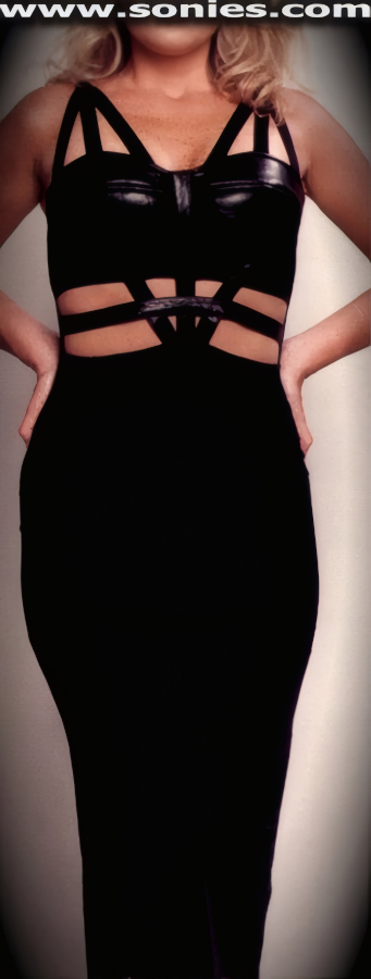 You'll Cause a Commotion on the Dance Floor when You Step-Out in this Charmingly Bound Bust-Out Cleavage style Stretch Satin Lycra and Leather Pull-On Cage Gown. Body Defining Dress that is Fully Suspended with Stretch Lycra Dramatic Cut-Out Triple Front Straps, Softly Padded Leather Cups to Enhance the Bust and Skin Baring Midriff Detail Finish. Lower Calf Length Skirt and Eye-Captivating Thigh High Center Slit Back Finally (15% Lycra, 85% Nylon, Leather). May be worn with stiletto heel shoes to create a phenomenal look. This style is perfect for stage, life style events, pride week, monthly play parties, fetish events, adult alternative lifestyle gatherings, bachelor parties, club wear, nightclubs, dance clubs and gentleman's clubs.   Style: 1123