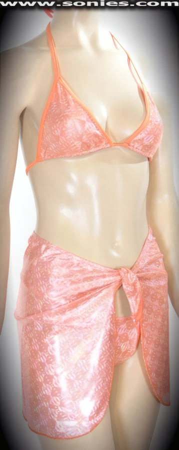Slip into this sexy Australe orange Aztec stretch Lycra glimmer hologram three piece bikini set when you want to obtain maximum attention. Adjustable slide and tie triangle top for minimal or maximum coverage and is designed to fit all busts. Complementing micro thong bottom with lined crotch detail finish. Includes a matching short wrap sarong that ties easily around your hips so that you are covered and free to cruise the beach or the dance floor. Created using four way stretch hologram Lycra fabric to trace your bodies contour and offers a stunning effect under any lighting (15% Lycra, 85% Nylon. Wash delicate and hang dry. Exposure to salt water and chlorine not recommended). May be worn with stiletto heel shoes to create a phenomenal look. This style is perfect for professional exotic dancers, life style events, pride week, monthly play parties, fetish events, adult alternative lifestyle gatherings, bachelor parties, club wear, gentleman's clubs, and to look your best at the beach or lounging at the pool.   Style: 551-047A