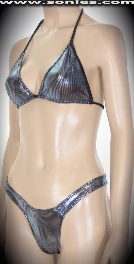 Every move you make is sure to thrill in this sensational Kang stretch Lycra glimmer hologram two piece bikini set. Adjustable slide and tie triangle top for minimal or maximum coverage and is designed to fit all busts. Complementing thong back bottom with sleek scoop front and lined crotch detail finish. Created using four way stretch hologram Lycra fabric to trace your bodies contour and offers a stunning effect under any lighting (15% Lycra, 85% Nylon. Wash delicate and hang dry. Exposure to salt water and chlorine not recommended). May be worn with stiletto heel shoes to create a phenomenal look. This style is perfect for professional exotic dancers, life style events, pride week, monthly play parties, fetish events, adult alternative lifestyle gatherings, bachelor parties, club wear, gentleman's clubs, and to look your best at the beach or lounging at the pool.   Style: 551-081