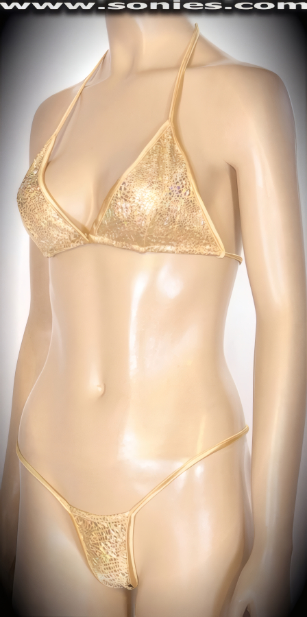 Cast a hypnotic spell in this intriguing Zetes stretch Lycra glimmer hologram two piece bikini set. Adjustable slide and tie triangle top for minimal or maximum coverage and is designed to fit all busts. Complementing micro thong bottom with lined crotch detail finish. Created using four way stretch hologram Lycra fabric to trace your bodies contour and offers a stunning effect under any lighting (15% Lycra, 85% Nylon. Wash delicate and hang dry. Exposure to salt water and chlorine not recommended). May be worn with stiletto heel shoes to create a phenomenal look. This style is perfect for professional exotic dancers, life style events, pride week, monthly play parties, fetish events, adult alternative lifestyle gatherings, bachelor parties, club wear, gentleman's clubs, and to look your best at the beach or lounging at the pool.   Style: 565-055