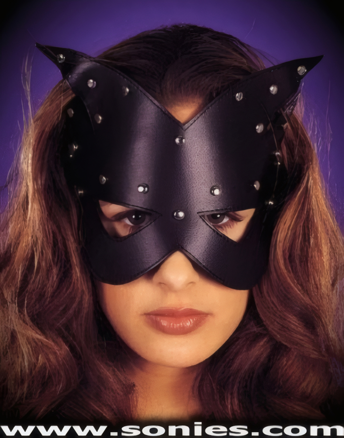 Set his temperature a boiling in this sinfully sexy Vinyl Cat's Eyes mask. Adorned with hand applied metal studs that are strategically separated to capture your audience's attention, plus has an elasticized back for a comfortable fit (35% Polyurethane, 65% Polyester. Hand wash cold, hang dry, no bleach). A must have costume accessory for any street carnival or theatrical production.   Style: 591020-JJ