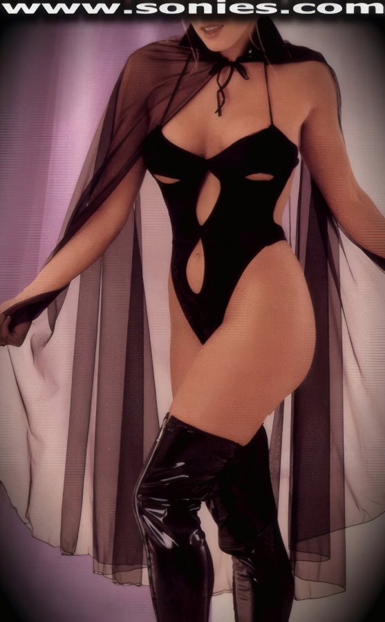 Seriously distracting in this ladies Midnight Rendezvous two piece set. Halter style soft stretch Velour thong back body suit with plunging neckline, peek-a-boo cups for added eye captivating appeal, dual keyhole design front bodice, hook back closure plus tie neck straps detail finish for off and on ease. Complementing filmy sheer fantasy cape with patent leather (PVC) collar and tie neck straps. It is perfect as a risqu� top with skirts, dress pants, jeans or under your favorite jacket. May be worn with stiletto heel shoes or boots to create a phenomenal look. This style is perfect for stage, bedroom performance, life style events, monthly play parties, fetish events, adult alternative lifestyle gatherings, bachelor parties, club wear, nightclubs, dance clubs and gentleman's clubs.   Style: 752-61202