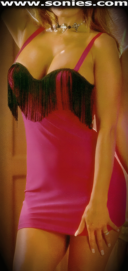 Captivate his attention in this sexy Emin stretch Lycra bust-out cleavage pull-on mini dress. Eye-captivating soft long fringe trim detail tracing along top of breast cups. Designed to Flatter and Fit You Beautifully. Stretch shoulder straps to ensure a great fit and formed breast cups to enhance the bust (15% Lycra, 85% Nylon). It pairs beautifully with any number of gloves. May be worn with stiletto heel shoes to create a phenomenal look. This style is perfect for stage, life style events, pride week, monthly play parties, fetish events, adult alternative lifestyle gatherings, bachelor parties, club wear, nightclubs, dance clubs and gentleman's clubs.   STYLE: 8120F