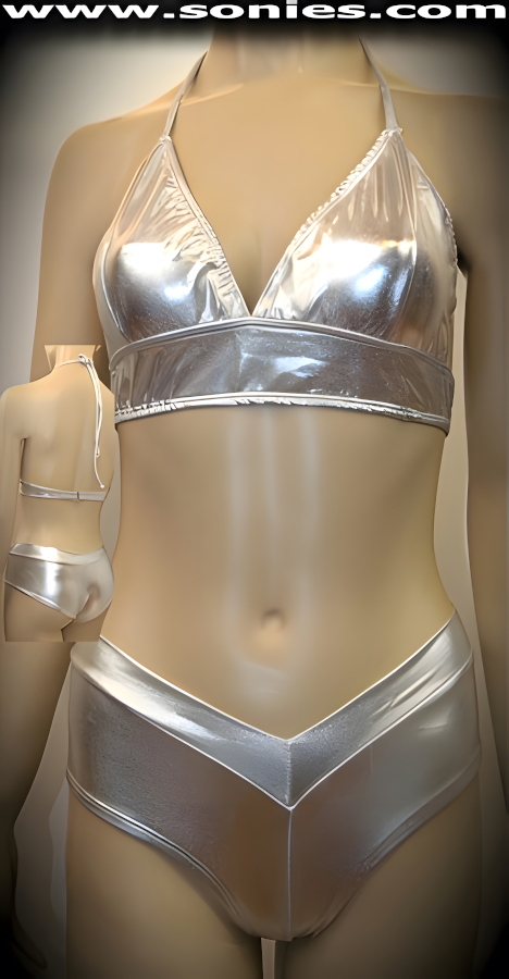 Dangerously sexy in this magnificent Arrakis well-sculpted two piece stretch liquid Lam� Lycra set. Seductive halter style conforming fit crop top that is designed to fit all busts. Adjustable spaghetti strap tie neck close to ensure a great fit, plus rear clasp closure for off and on ease detail finish. Contoured seaming enhances its conforming shape. Includes a matching curve hugging V-front pull-on cheeky hot pants to complete this magnificent vesture. The low rise design makes the torso look longer, while the high-cut thigh elongates the legs, for an incredibly seductive silhouette (15% Lycra, 85% Nylon). It pairs beautifully with any number of risqu� gloves. May be worn with stiletto heel shoes or boots to create a phenomenal look. This style is perfect for stage, life style events, pride week, monthly play parties, fetish events, adult alternative lifestyle gatherings, bachelor parties, club wear, nightclubs, dance clubs and gentleman's clubs.   Style: TUS-1186