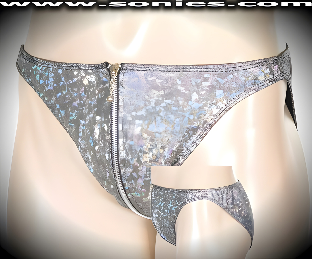 Men's Dionysus Zip-Around and Breakaway Dance Wear Bottom in Silver Crushed Ice Stretch Lycra Hologram. Aluminum Metal Break-Away Zipper that Zips Undone with Metal Chain and Ball Tip Puller from Front to Back. Tantalizing front open-ended aluminum metal break-away zipper that zips undone with metal chain and ball tip puller from front to back. This bold unlined pouch styling offers both added peek-a-boo teasing effect or dramatic off and on ease finally (20% Spandex, 80% Nylon). It pairs boldly with any number of gallant tops. May be worn with black casual shoes or boots to create a phenomenal look. This blistering style is perfect for Life Style Events, Men's Competition Wear, Wrestling Shows, Pride Week, Monthly Play Parties, Fetish Events, Adult Alternative Lifestyle Gatherings, Clubwear, Nightclubs, Dance Clubs, Ladies Night Clubs, Bachelorette Parties, Male Exotic Chippendale Dancers, Girls Night Out Parties and more. Try this popular hot style for yourself today!   Style: UMS-930