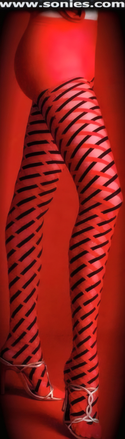 Beautifully Engineered Sheer and Opaque Argyle Designed Two Tone Stretch Lycra Pantyhose. Single seam with sandal foot finally. Adds a fresh new look to your wardrobe. Conforms to your curves for a sleek comfortable fit. This style is suitable for Eveningwear, Daywear, Special Occasions and Club Wear (12% Lycra, 88% Nylon exclusive of trim. Hand wash cold and drip dry, no bleach).   Style: 7207