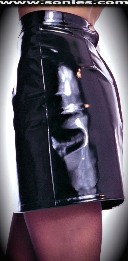 Dress to Thrill in this Figure Sleeking Dancewear Contoured Patent Leather Slim Line Mini Skirt with Back Zip and Snap Closure for Off & On Ease Detail Finish.   STYLE: V4002