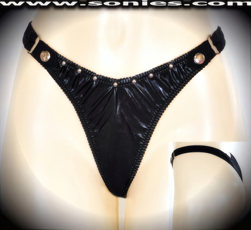 Breeze on by your competition as you bump and grind in this exquisite ladies Parikia scoop front racy black patent leather (PVC) dance wear low-rise bottom with suggestive unlined crotch detail finish. Features tantalizing metal D-ring sides, plus break-away metal snaps band detailing that just begs to be undone. Mercilessly sexy hand applied perimeter metal studs accent on the front and are strategically separated to create an impressive look. Crafted with an exquisite stretch satin Lycra thong back to ensure a great fit (PVC: 35% Polyurethane, 65% Polyester. Lycra: 15% Spandex, 85% Nylon. Hand wash cold, hang dry, no bleach). It pairs beautifully with any number of risqu� patent leather (PVC) tops. May be worn with stiletto heel shoes or boots to create a phenomenal look. This style is perfect for stage, bedroom performance, life style events, pride week, monthly play parties, fetish events, adult alternative lifestyle gatherings, bachelor parties, club wear, nightclubs, dance clubs and gentleman's clubs.   Style: 69NFC