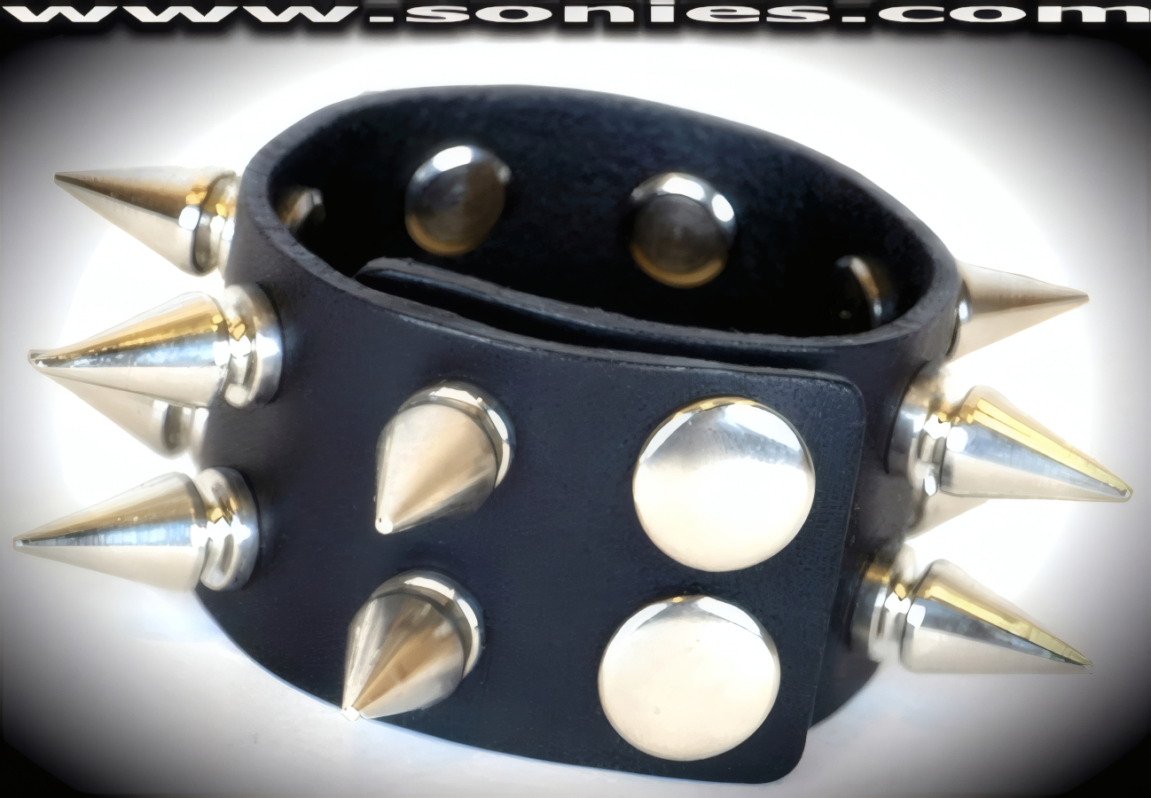 Attention Captivating in this Allalihorn leather wristband. A perfect accessory to add a little unconventional styling to your wardrobe. This quality piece is crafted from genuine leather and features bold metal spikes. 1�-inch wide leather with 2 rows of �-inch long screw on metal spikes and adjustable metal snaps closure (Sold as adult novelty only. This item may not be legal in your state or country therefore it is your obligation to check local and state laws before ordering). This style is perfect for stage, life style events, pride week, monthly play parties, fetish events and adult alternative lifestyle gatherings.   Style: LC-SPIKE2