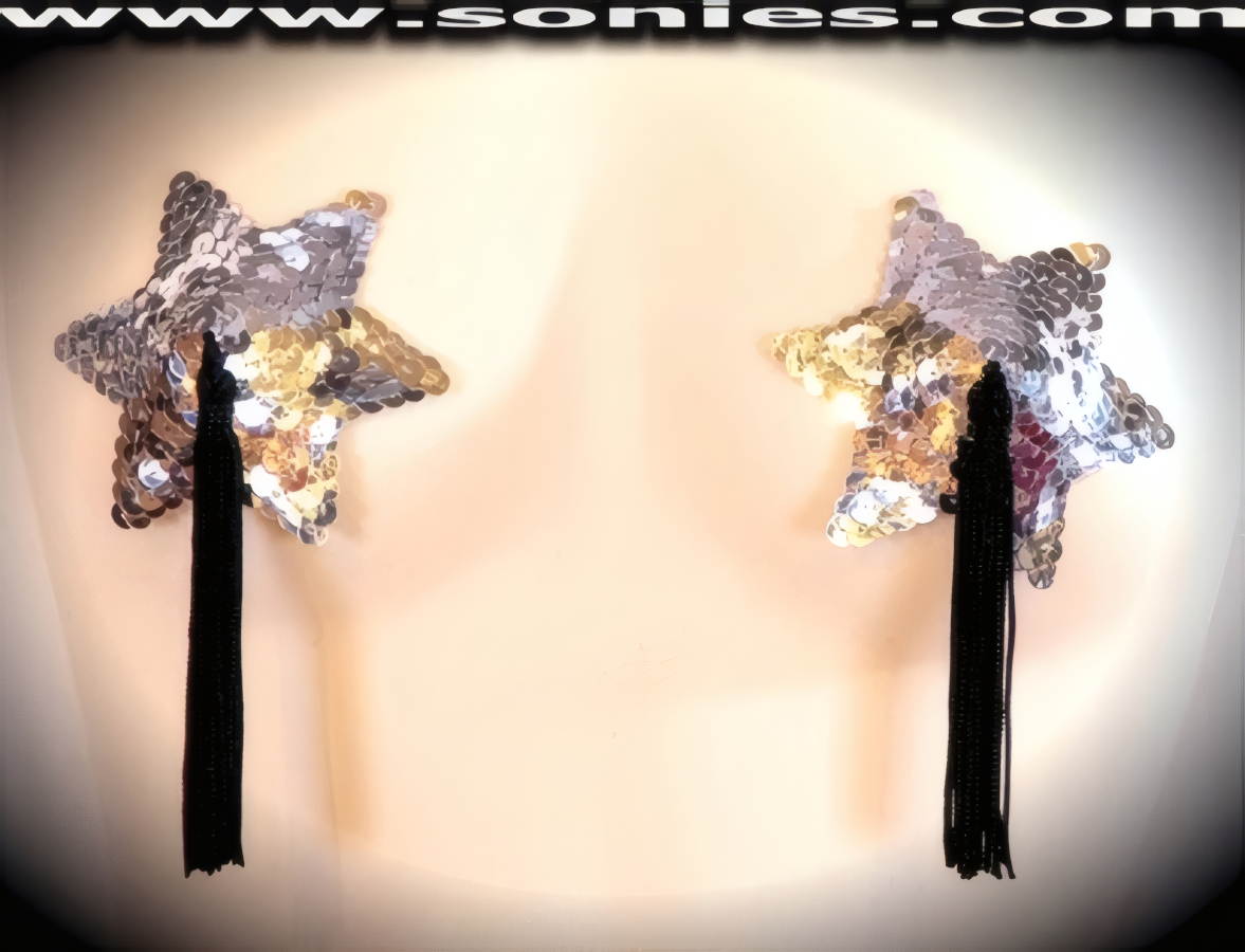 Hold on, we are in for a ride when you step-out on the stage wearing these exquisite hand crafted burlesque Traviata glimmer star shaped sequined pasties that are adorned with attached tassels finally for added twirling and whirling effect. Designed using the finest sequins for utmost radiance so that it is perfect under any lighting (One pair per package with Glue included). These Pasties are meant to surprise, seduce, and unleash desires beyond your wildest dreams. No detail was spared and no wish was denied. For stage or bedroom performance. Can be worn by Professionals or Semi Pro Burlesque Dancers, Pin-up Girls, Strip Tease, Exotic Dancers, Adult Entertainers, Transgenders, Transsexuals, Cross-Dressers, Cabaret Dancers, Pole Dancers and for Photography Models.   Style: 7010AH