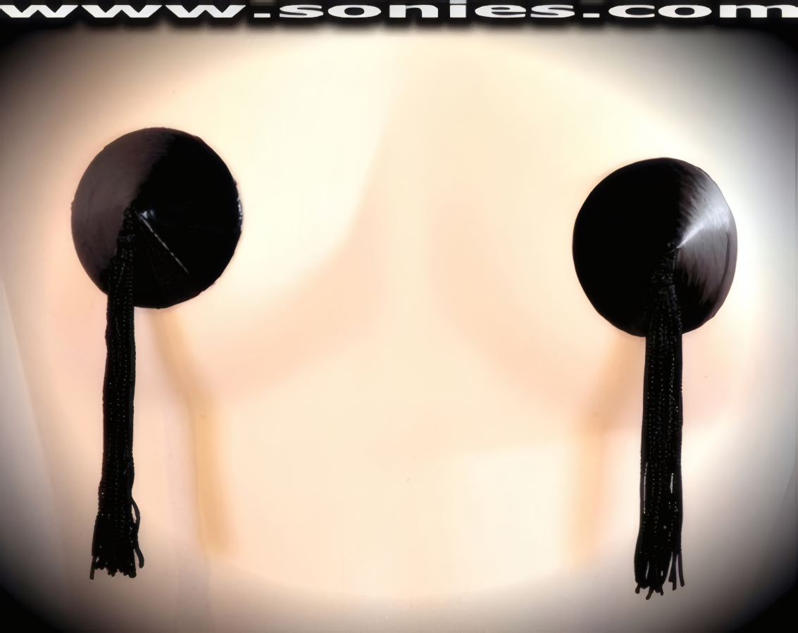 Stand out from the crowd wearing these magnificent hand crafted Diana patent leather (PVC) Pasties with attached tassels finally for added twirling and whirling effect (35% Polyurethane, 65% Polyester). These Pasties are meant to surprise, seduce, and unleash desires beyond your wildest dreams. For stage or bedroom performance. Can be worn by Professionals or Semi Pro Burlesque Dancers, Pin-up Girls, Strip Tease, Exotic Dancers, Adult Entertainers, Transgenders, Transsexuals, Cross-Dressers, Cabaret Dancers, Pole Dancers and for Photography Models (One pair per package with Glue included).   Style: 7016AH
