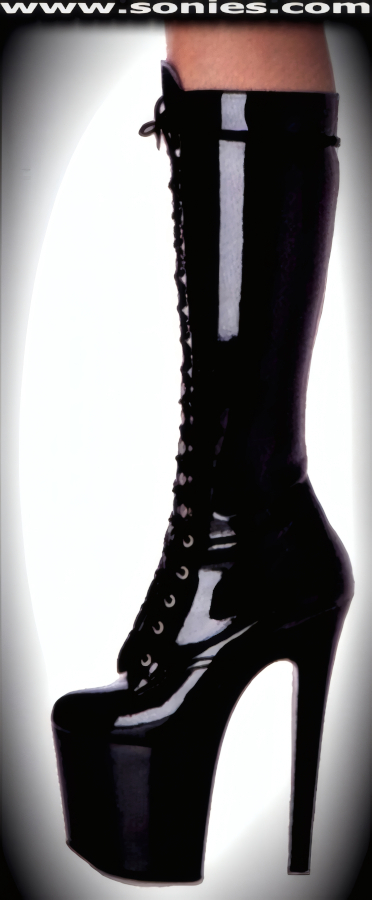 Absolutely luscious and dominating in these provocative Vesta patent leather (PVC) knee high boots. Crafted with full front bi-directional lace-up which accommodates a wider variety of calf sizes and to ensure a comfortable fit. Has a soft cushioned suede leather insole, plus 7�-inch spike heel and 3�-inch platform finally. These boots have quality genuine professional-grade suede footbeds with a slight arch for the best comfort, feel and fit your feet will experience. Pure color plastics in the platform (bottom) units and the softest patent leather (PVC) in the uppers, plus are proudly Made in the United States of America. Compare the same boot sizes� weight of these against our competitors and you will feel that weight difference. If you compare the same boot sizes� outer sole with these against our competitors� imports then you will clearly see how sexy and dainty our boots truly are. Every one of these boots is individually inspected prior to leaving our factories. We maintain an extremely critical eye on quality. Every pair of these boots we sell represents our commitment to our reputation. This style is perfect for Cheerleaders, Exotic Dancers, stage, life style events, pride week, monthly play parties, fetish events, adult alternative lifestyle gatherings and gentleman's clubs.   Style: DREAM75