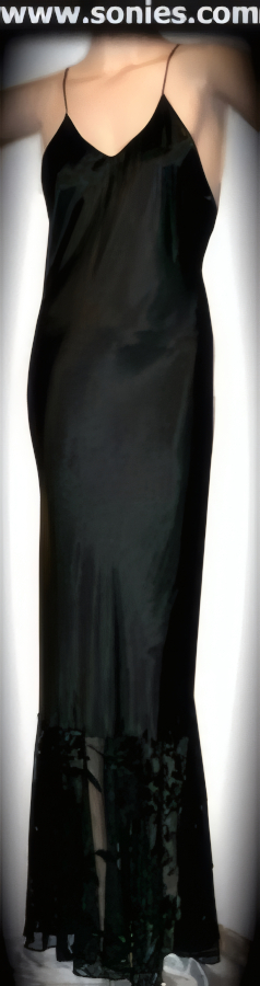 Captivate his attention in this sexy Tyre long silky satin body tracing gown. Beautifully seductive low dipping neckline with spaghetti shoulder straps, princess line seaming and extreme dramatic sheer floral chiffon detail finish hem. This magnificent gown may be worn beneath a long dress or skirt to help it hang smoothly and to prevent chafing of the skin from coarse fabrics such as wool. May be worn with stiletto heel shoes to create a phenomenal look. This style is perfect for bedroom performance, life style events, monthly play parties, fetish events, adult alternative lifestyle gatherings, bachelor parties and gentleman's clubs.   STYLE: 2561AS