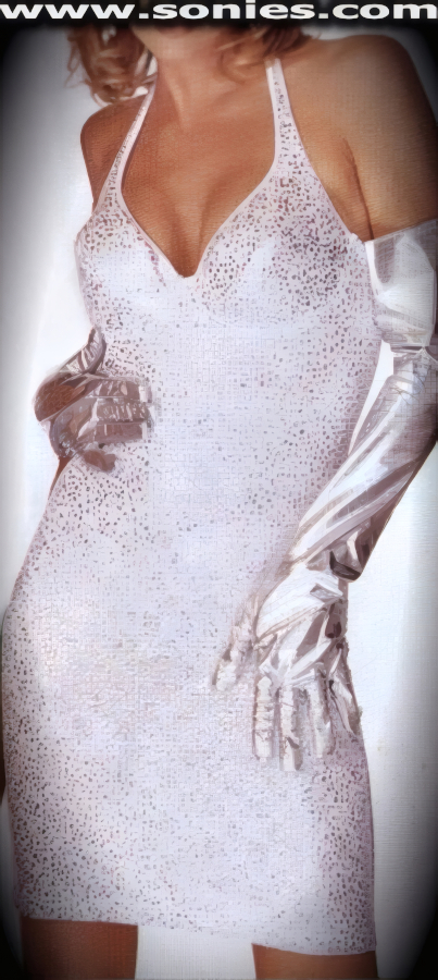 Bring on the night as you dress to thrill in this Sawda enchanting glitzy stretch Lycra halter style bust-out cleavage mini dress. Firm underwired softly padded cups to enhance the bust, plus hook neck closure for off and on ease detail finish (15% Lycra, 85% Nylon). It pairs beautifully with any number of gloves. May be worn with stiletto heel shoes to create a phenomenal look. This style is perfect for stage, life style events, monthly play parties, fetish events, adult alternative lifestyle gatherings, bachelor parties, club wear, nightclubs, dance clubs and gentleman's clubs.   Style: 3654GH