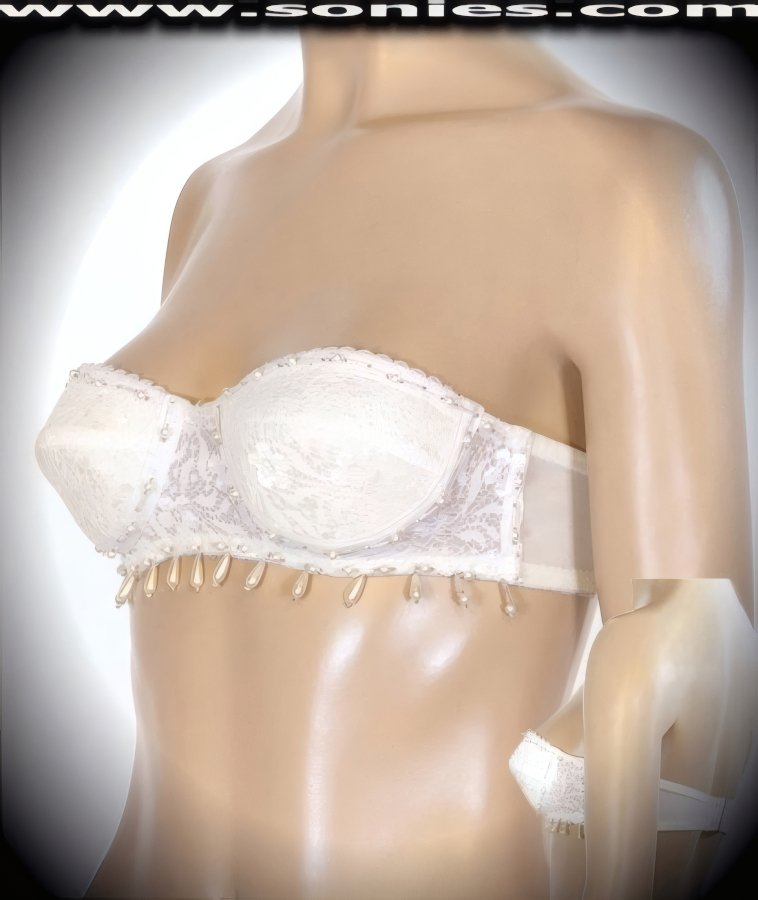 Innocently provocative in this Rossetti glamorous hand beaded lace and faux pearls accented strapless bra style bustier. Cleavage enhancing design with molded underwired cups that takes a small bustline and pushes it up to create a magnificently deep cleavage. Adjustable hook and eye back closure to ensure a great fit. It pairs beautifully with any number of risqu� bottoms such as skirts, hot pants, thongs or G-Strings. May be worn with stiletto heel shoes or boots to create a phenomenal look. This style is perfect for stage, life style events, pride week, monthly play parties, fetish events, adult alternative lifestyle gatherings, bachelor parties, club wear, nightclubs, dance clubs and gentleman's clubs.   Style: 4997SC