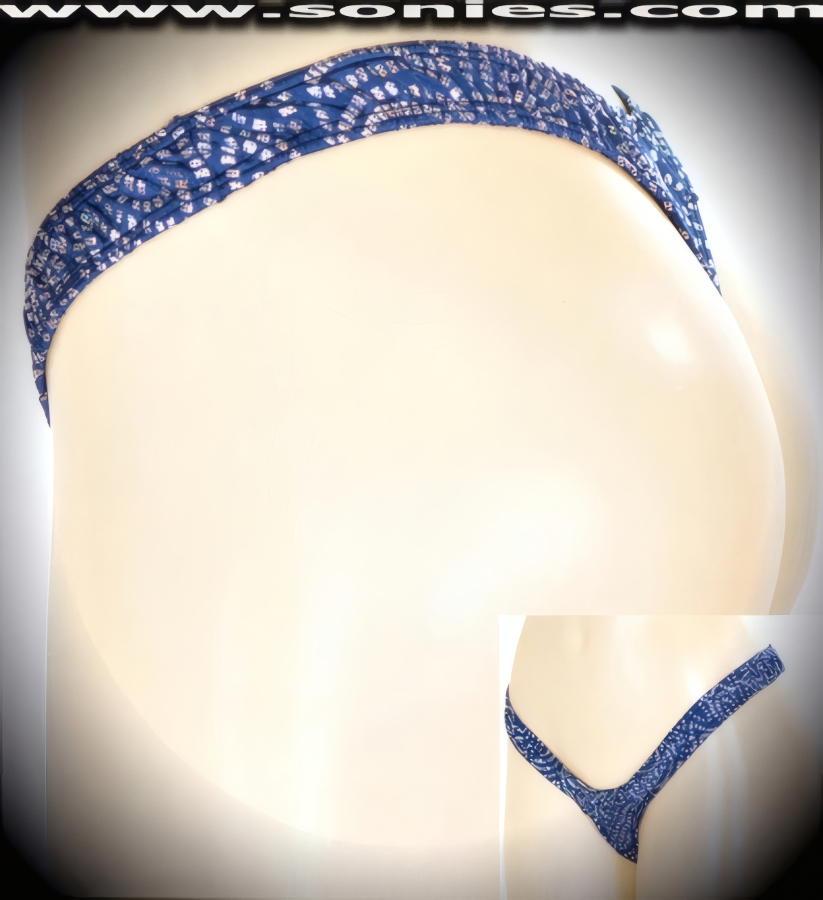 The sweetest of sweet nothings, in this barely-there adult entertainer's Peri low-rise stretch glitter Aztec swirl silver hologram Lycra center stage dance wear thong bottom. Irresistibly enticing panty is designed with a low scoop front, lined crotch and thong back detail finish. Crafted using quality 4 way stretch hologram Lycra fabric to trace your bodies contour and ensure a great fit (15% Lycra, 85% Nylon exclusive of trim. Hand wash cold and drip dry, no bleach). It pairs beautifully with any number of risqu� tops. May be worn with stiletto heel shoes to create a phenomenal look. This style is perfect for stage, bedroom performance, life style events, pride week, monthly play parties, fetish events, adult alternative lifestyle gatherings, bachelor parties and gentleman's clubs.   Style: 551-001FSC