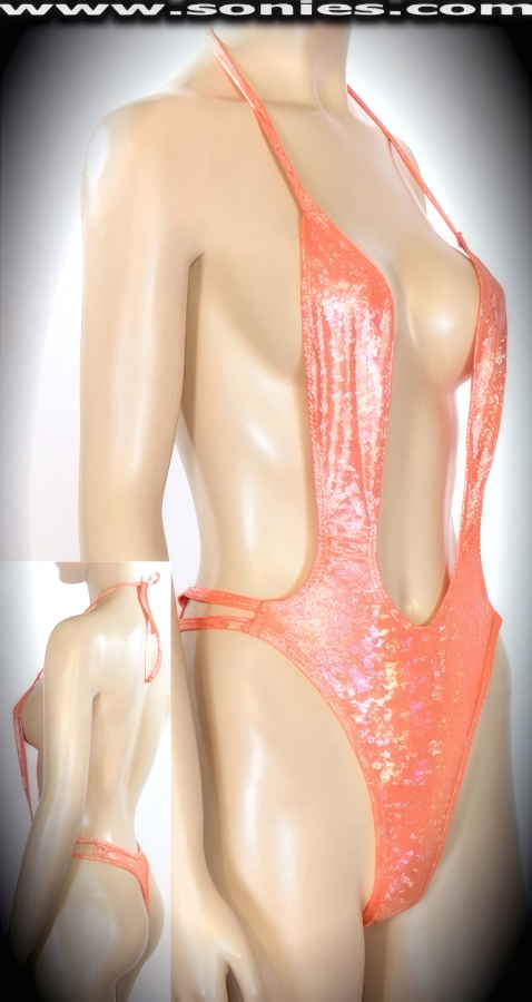 Perfect for a day at the Tinseltown beach in this amazing Calle halter style stretch glimmer hologram Lycra one-piece thong back monokini. Designed with a dramatic deep plunging neckline, open back, lined crotch, dual strappy cutout sides, plus ties behind neck to ensure a great fit. Created using four way stretch glimmer hologram Lycra fabric to trace your bodies contour and offers a stunning effect under any lighting (15% Lycra, 85% Nylon. Wash delicate and hang dry. Exposure to salt water and chlorine not recommended). May be worn with stiletto heel shoes to create a phenomenal look. This style is perfect for professional exotic dancers, life style events, pride week, monthly play parties, fetish events, adult alternative lifestyle gatherings, bachelor parties, club wear, gentleman's clubs, and to grab serious attention when worn at the beach or lounging at the pool.  Style: 670-030B