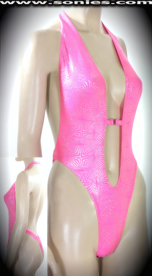 Show off your sex appeal and your creative panache in this Humera halter style stretch Lycra glitter foil one-piece thong back monokini. Designed with a dramatic deep plunging keyhole neckline, open back, lined crotch, tantalizing center front metal O-ring connect, plus neck back clasp closure for off and on ease detail finish. Created using four way stretch glitter foil Lycra fabric to trace your bodies contour and offers a stunning effect under any lighting (15% Lycra, 85% Nylon. Wash delicate and hang dry. Exposure to salt water and chlorine not recommended). May be worn with stiletto heel shoes to create a phenomenal look. This style is perfect for professional exotic dancers, life style events, pride week, monthly play parties, fetish events, adult alternative lifestyle gatherings, bachelor parties, club wear, gentleman's clubs, and to grab serious attention when worn at the beach or lounging at the pool.   Style: 670-082E