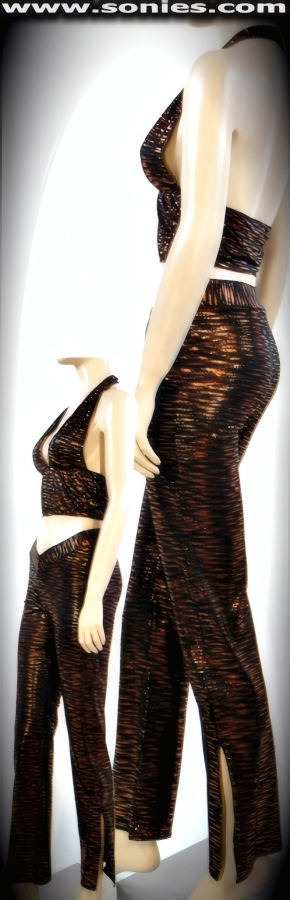 Get dressed with Impact In this Magnificent Stretch Spandex Two Piece Set. Bare Midriff Halter Top with Low Plunge Front and Hook Neck Closure. Pull-On Hip-Hugger Pant with V-Front Waistband and Side Leg Base Slit Finish (15% Lycra, 85% Nylon).   STYLE: 988-71B