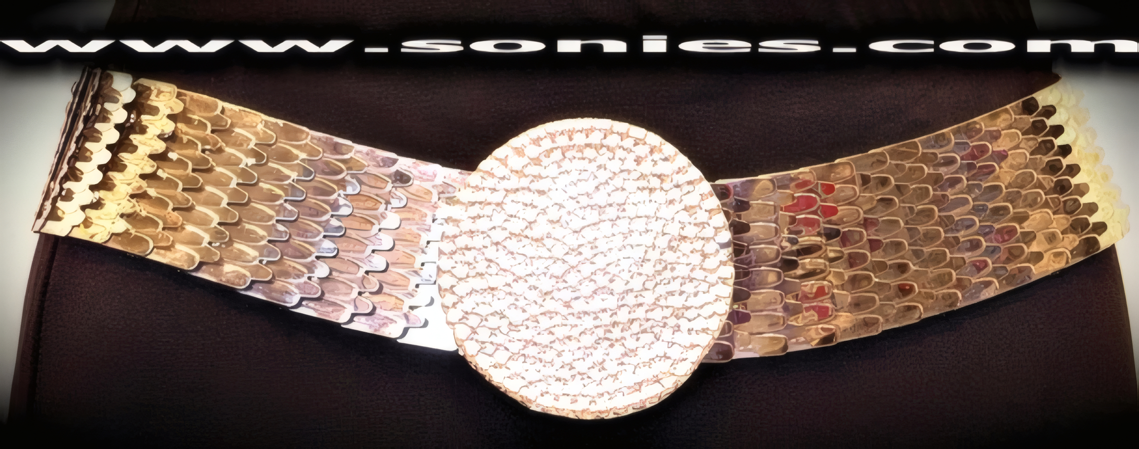Make a bold fashion statement with this amazing Ladies Kubabat Stretch Serpentine Metal Belt. Silver Metal Pieces Intricately spaced on a Soft Elasticized 1�-Inch Wide Band and Large Circle Buckle Detail Finish. Versatile Length expansion.   STYLE: BC-006R