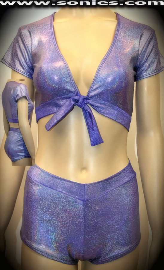 Envelop yourself in this glorious Halla glimmer hologram stretch Lycra two piece set. Seductive short sleeve crop top with tie front closure for off and on ease plus to ensure a great fit. Complete with matching curve hugging cheeky V-front pull-on hot pants (15% Lycra, 85% Nylon). It pairs beautifully with any number of risqu� gloves. May be worn with stiletto heel shoes or boots to create a phenomenal look. This style is perfect for stage, life style events, pride week, monthly play parties, fetish events, adult alternative lifestyle gatherings, bachelor parties, club wear, nightclubs, dance clubs and gentleman's clubs.   Style: CLS-901D