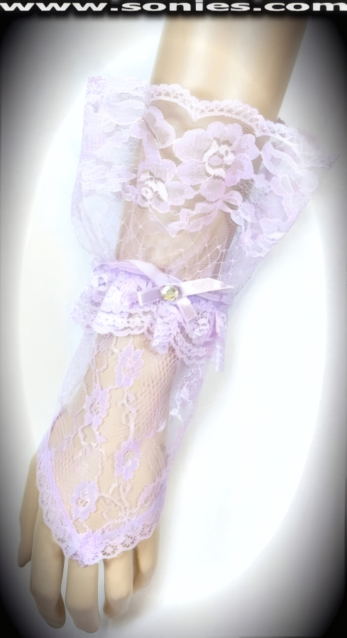 Glamorous Vesta European floral lace short fingerless gloves. Gorgeous floral lace pattern with middle finger loop, large ruffle lace wrist, satin bow plus rhinestone center detail finish. Adds an elegant touch to your attire. Dainty lace fingerless gloves have a playful ambiance, much more so than formal opera length gloves. This style is perfect for formal, bridal, prom, d�butante and Opera Ball.   Style: MFG-72803C