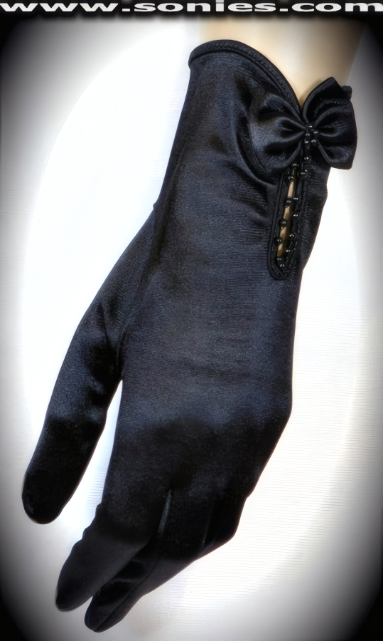Shaping a statement in these superbly crafted Cybele stretch satin Lycra wrist length gloves with black beaded peek-a-boo keyhole inset and satin bow appliqu� cuff detail finish (15% Lycra, 85% Nylon exclusive of trim. Hand wash cold and drip dry, no bleach). It pairs beautifully with any number of vestures. This style is perfect for formal, bridal, prom, d�butante and Opera Ball.   Style: OTS001