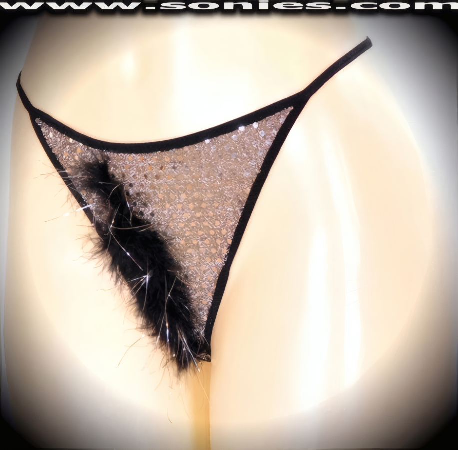 Wonderfully naughty in this superbly sheer ladies Kailash low-rise glittery sequin with lurex dance wear G-String back bottom. This panty is made even more enticing by means of an eye-alluring slightly concealing soft marabou front with shiny silver strands for ultimate effect. Crafted with a suggestive unlined crotch, plus soft elasticized waistband to ensure a great fit and stunning V-Shape back finally (5% Spandex, 65% Polyester, 30% Lurex. Hand wash cold, hang dry, no bleach). It pairs beautifully with any number of risqu� tops. May be worn with stiletto heel shoes or boots to create a phenomenal look. This style is perfect for stage, bedroom performance, life style events, pride week, monthly play parties, fetish events, adult alternative lifestyle gatherings, bachelor parties, club wear, nightclubs, dance clubs and gentleman's clubs.   Style: YQ001A