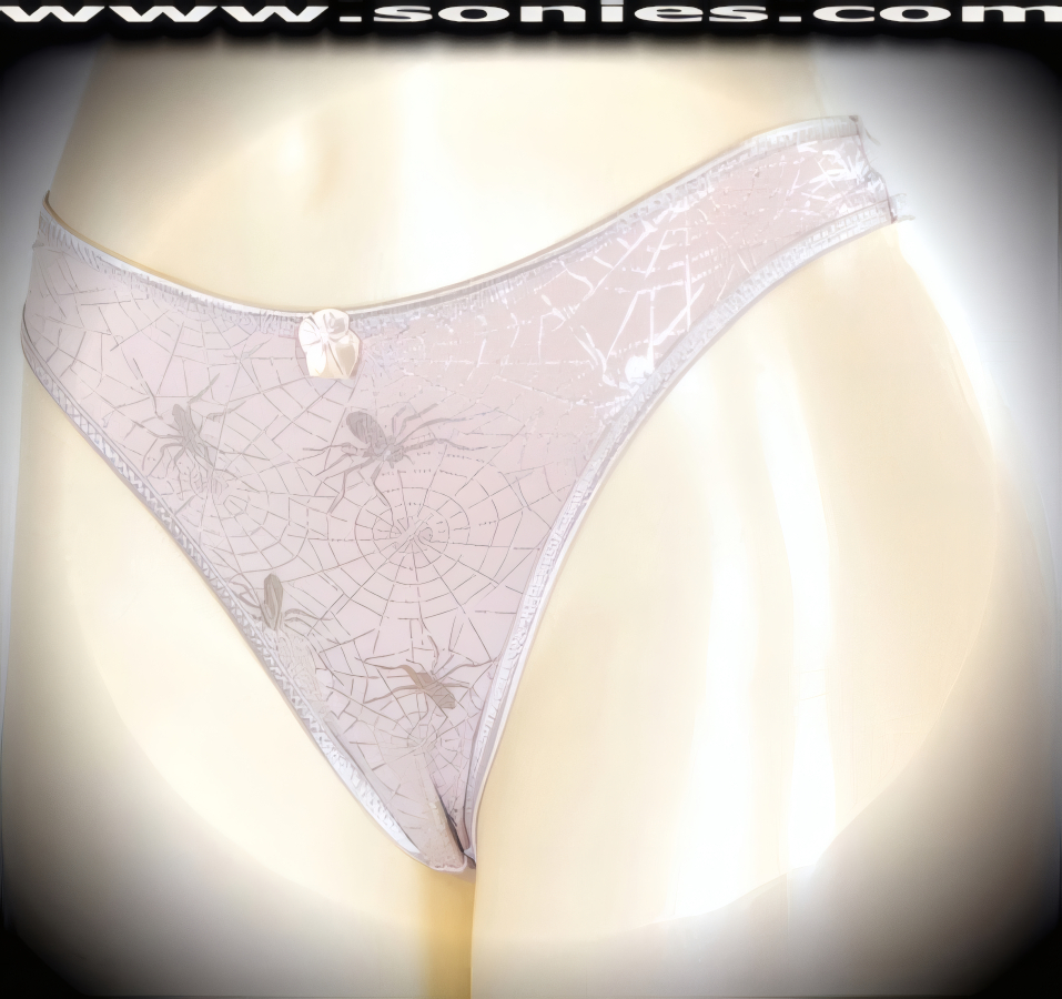 Make it a stage show night to remember in this sensational adult entertainer's low-rise Haramosh stretch Lycra with silver metallic foil spider print dance wear thong bottom. Irresistibly enticing panty features a cotton lined crotch, soft elasticized edging to insure a comfortable fit, plus a satin bow appliqu� front detailing finish (10% Lycra, 90% Nylon. Wash delicate and hang dry). It pairs beautifully with any number of risqu� tops. May be worn with stiletto heel shoes or boots to create a phenomenal look. This style is perfect for stage, bedroom performance, life style events, pride week, monthly play parties, fetish events, adult alternative lifestyle gatherings, bachelor parties and gentleman's clubs.   Style: YQ630C