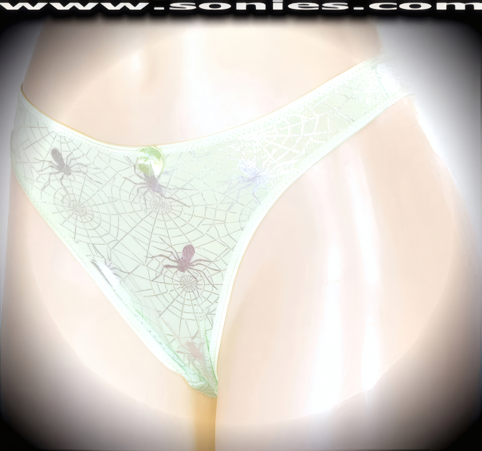 Make it a stage show night to remember in this sensational adult entertainer's low-rise Haramosh stretch Lycra with silver metallic foil spider print dance wear thong bottom. Irresistibly enticing panty features a cotton lined crotch, soft elasticized edging to insure a comfortable fit, plus a satin bow appliqu� front detailing finish (10% Lycra, 90% Nylon. Wash delicate and hang dry). It pairs beautifully with any number of risqu� tops. May be worn with stiletto heel shoes or boots to create a phenomenal look. This style is perfect for stage, bedroom performance, life style events, pride week, monthly play parties, fetish events, adult alternative lifestyle gatherings, bachelor parties and gentleman's clubs.   Style: YQ630E