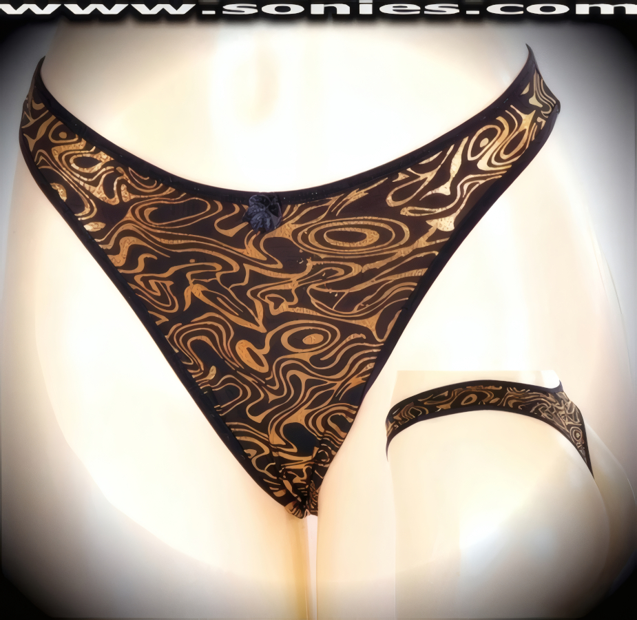 Be flirtatious in this Austria stretch Lycra dance wear bottom with gold metallic foil orbital oasis design. Crafted with a lined crotch and thong back, plus satin bow appliqu� front detail finish (10% Lycra, 90% Nylon. Wash delicate and hang dry). It pairs beautifully with any number of risqu� tops. May be worn with stiletto heel shoes or boots to create a phenomenal look. This style is perfect for stage, bedroom performance, life style events, pride week, monthly play parties, fetish events, adult alternative lifestyle gatherings, bachelor parties and gentleman's clubs.   Style: YQ670